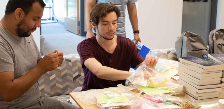 Students stuffing bags