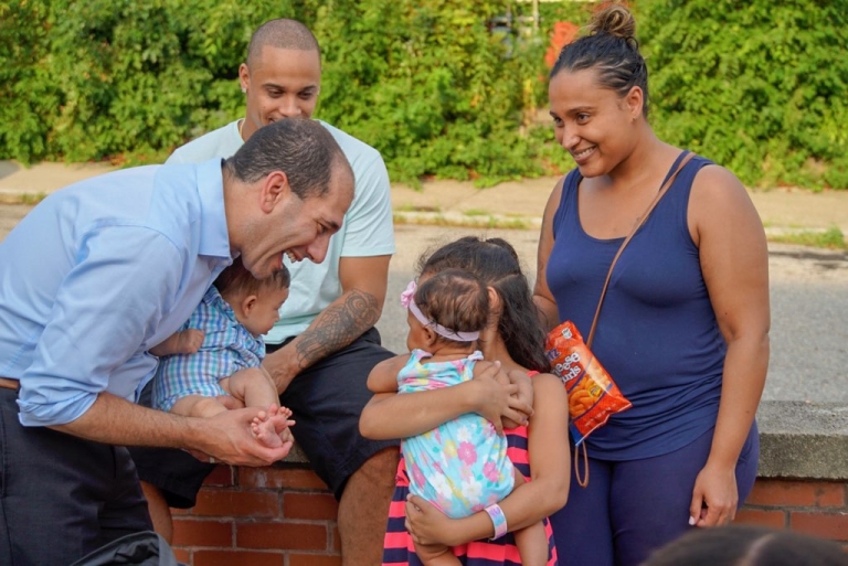 Providence City Councilor David Salvatore speaks with constituents on the street