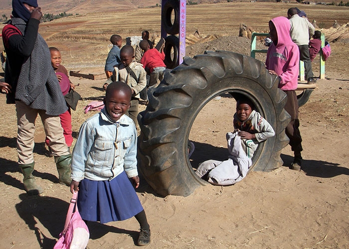 Children playing in the school yard at recess