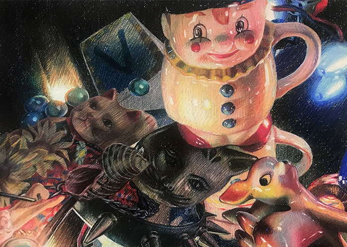 Still life depicting a clown cup, ceramic lamb and cat faces in weird lighting