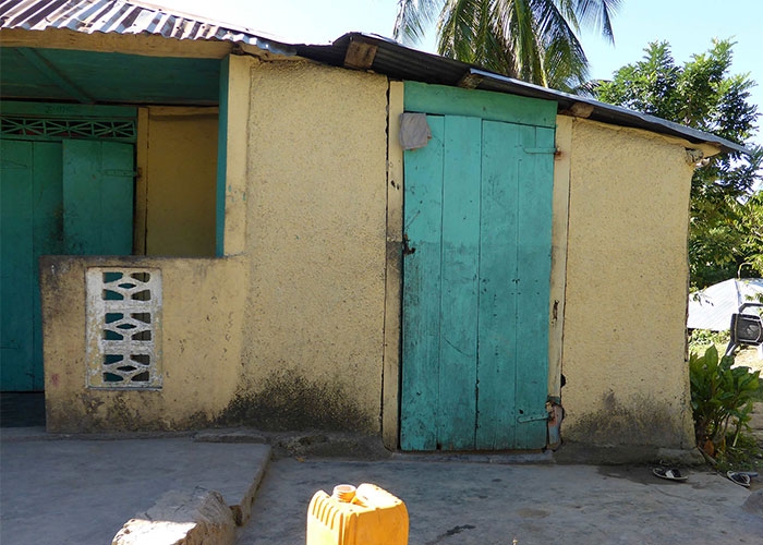 First iteration of clinic as a shed attached to end of villager's hut