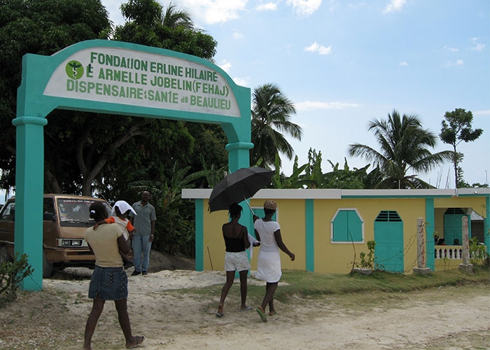 Villager head down the road to the clinic