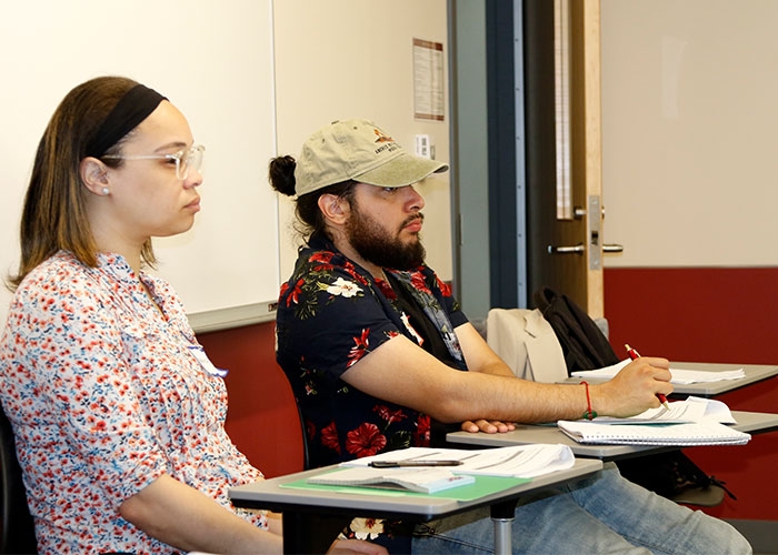 RIC students listen to facilitator of training