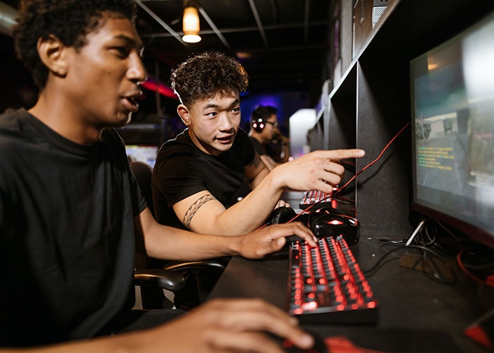 Teenage boys work on computers