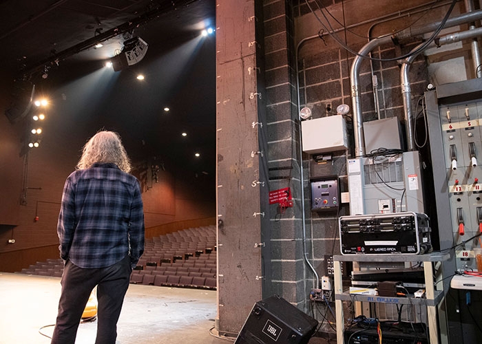 Alan looks out on stage