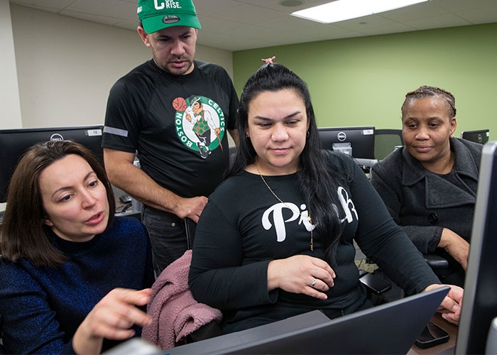 ESL instructor works with students