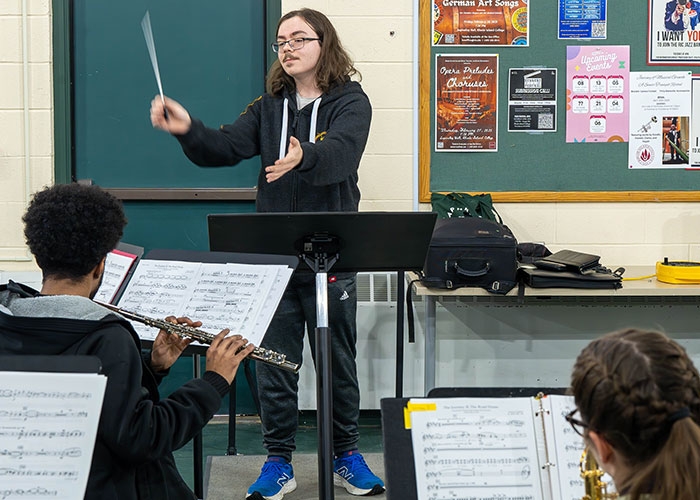 Zach Fulford conducting in horizontal shot