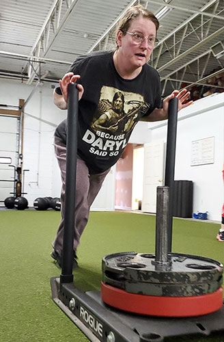 Kim Calcagno pushing a 245lbs sled.