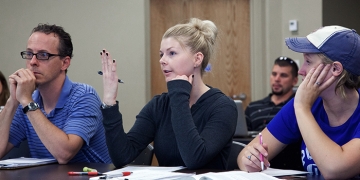 Psychology students Andrew Kerbs, Nicole Cesaroni and Hillary Hewitt attend a psychology class at RIC.