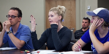 ​​Psychology students Andrew Kerbs, Nicole Cesaroni and Hillary Hewitt attend a psychology class at RIC. 