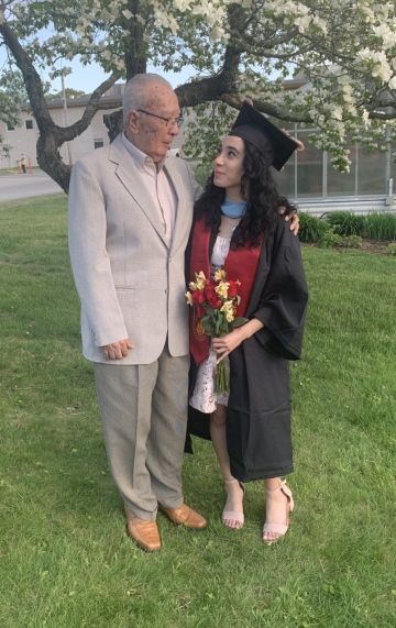 Emily with her grandfather facing each other