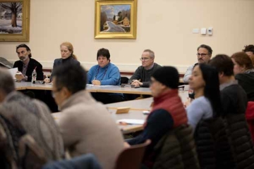Faculty and staff members in a meeting