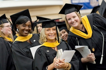 Graduate students in their caps and gowns for commencement