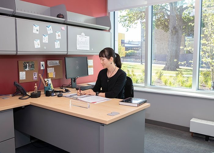 Faculty member in office in Clarke Science