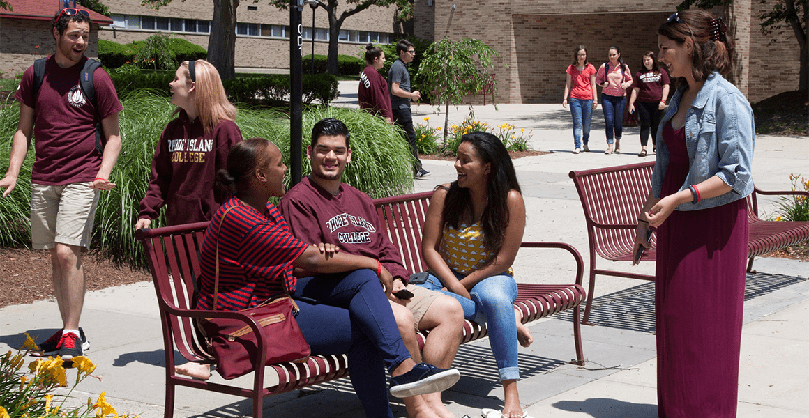 Students walking to class and chatting on the quad