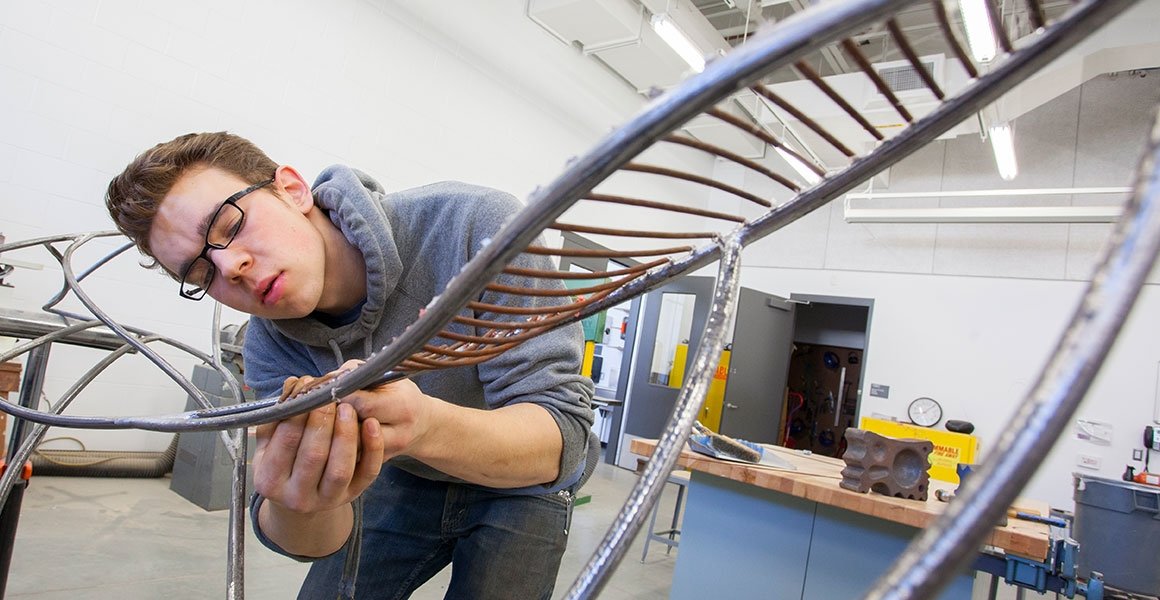 Art student works on a sculpture