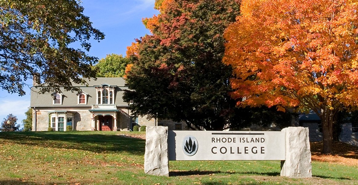 Forman Center with RIC stone sign and beautiful fall trees