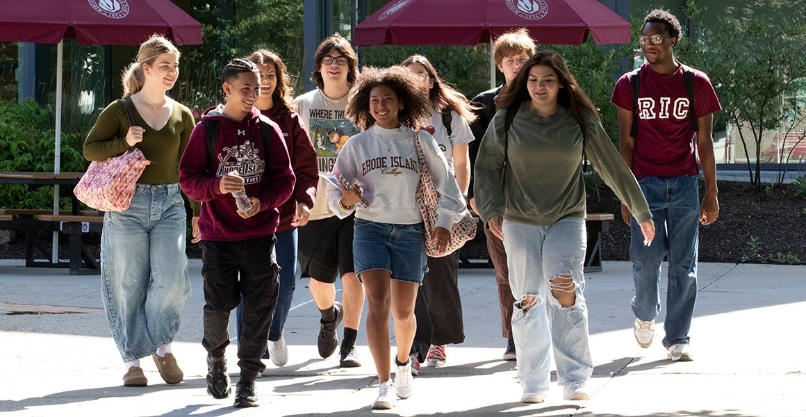 Students in RIC gear walking together on campus