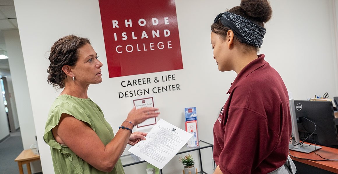 Career & Life Design Center director working with a student