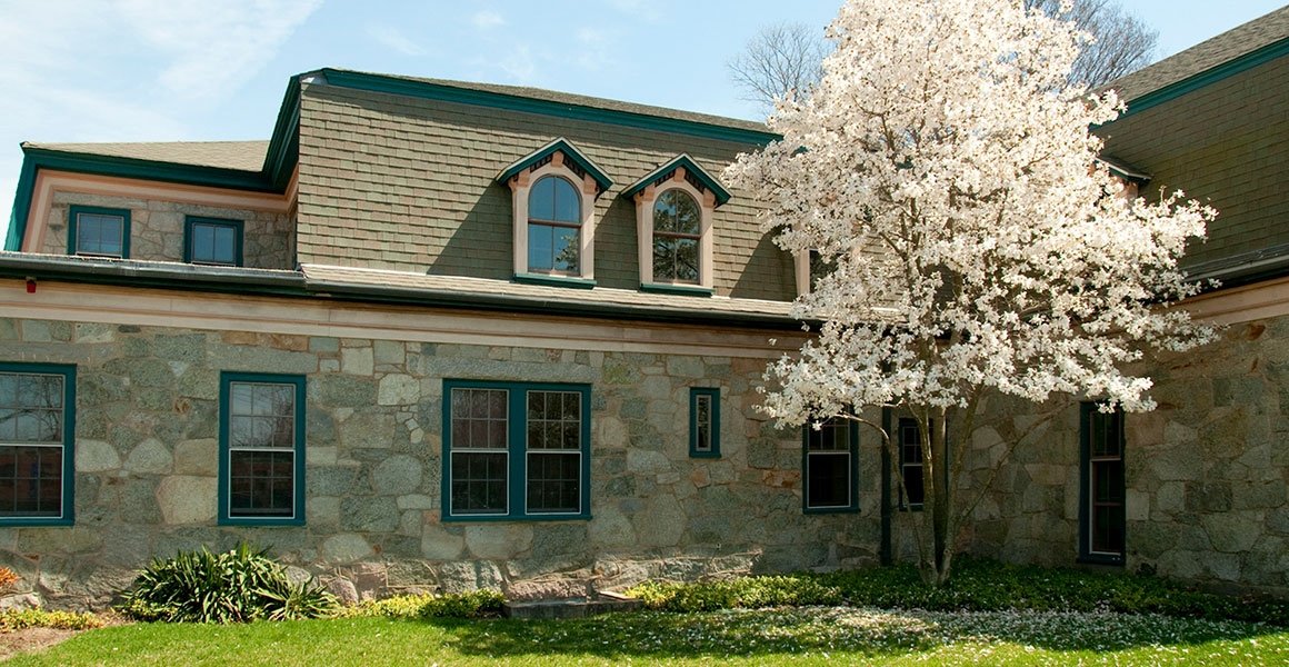 Exterior of Forman Hall, an old stone building on RIC's campus
