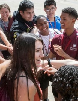 Students in a huddle at orientation