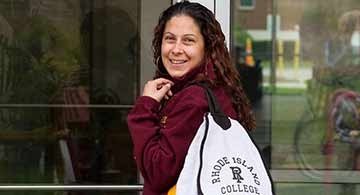 student entering a building from outside