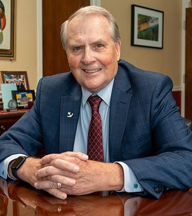 President Warner at his desk