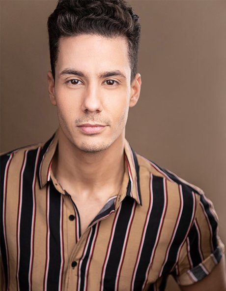 Professional headshot of Alex Gil Cruz