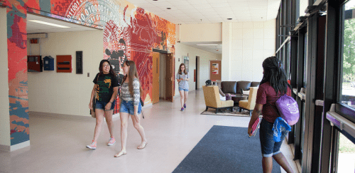 Students inside Whipple Hall walking to class