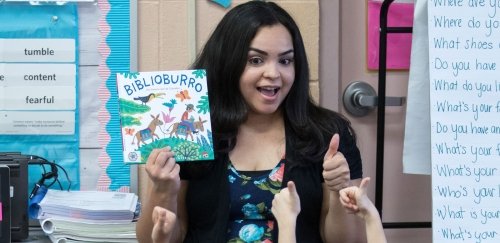 Teacher reading book to class