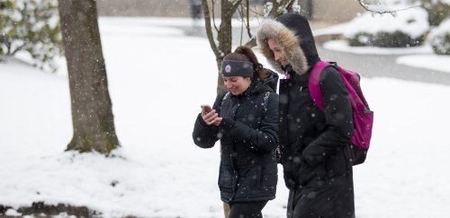 RIC Students walking on campus in the winter