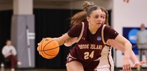 RIC Women's Basketball forward Jayda Bing dribbles the ball past a defender during a game.