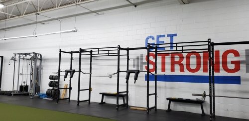 Inside of gym with gym equipment