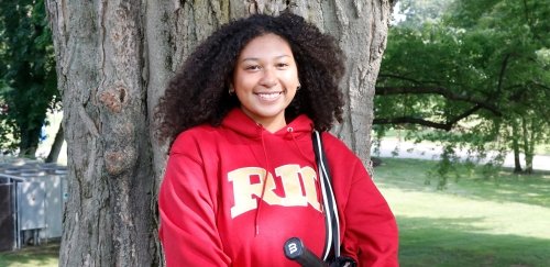 Isabella Ba poses in her RIC sweatshirt