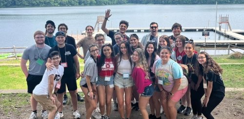 photo of group by a lake