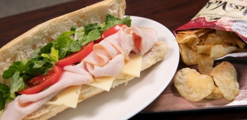 Sub sandwich with bag of potato chips
