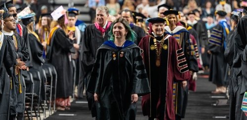 Faculty, President Warner, and government leaders walking into commencement ceremony