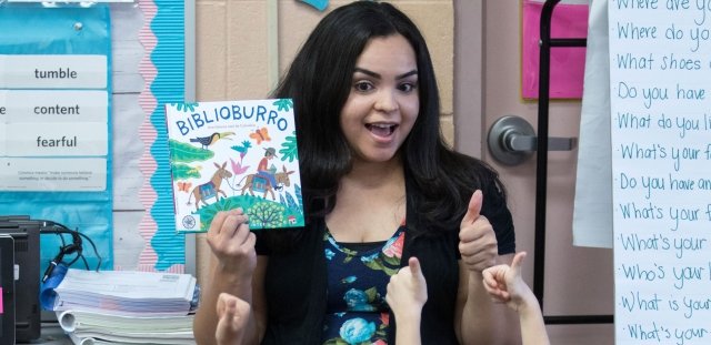 Teacher reading book to class