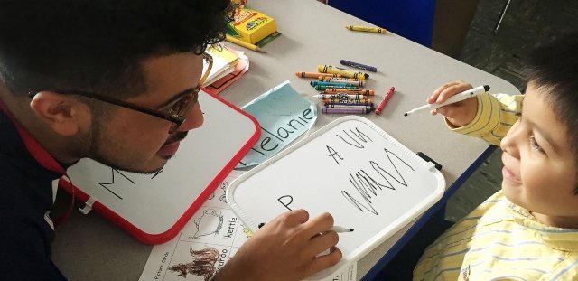 Teacher talking to child