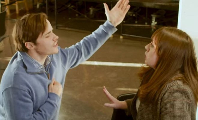 Young man on knees appealing to a young girl