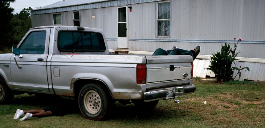 Color photograph of a silver pickup truck